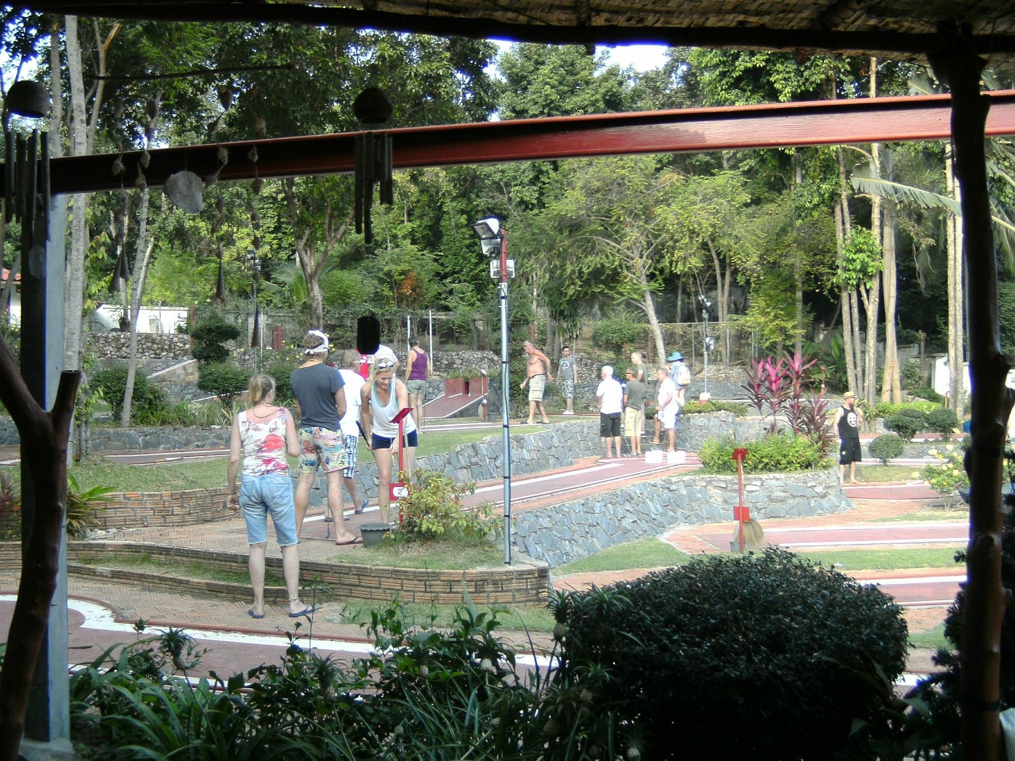 big group playing minigolf